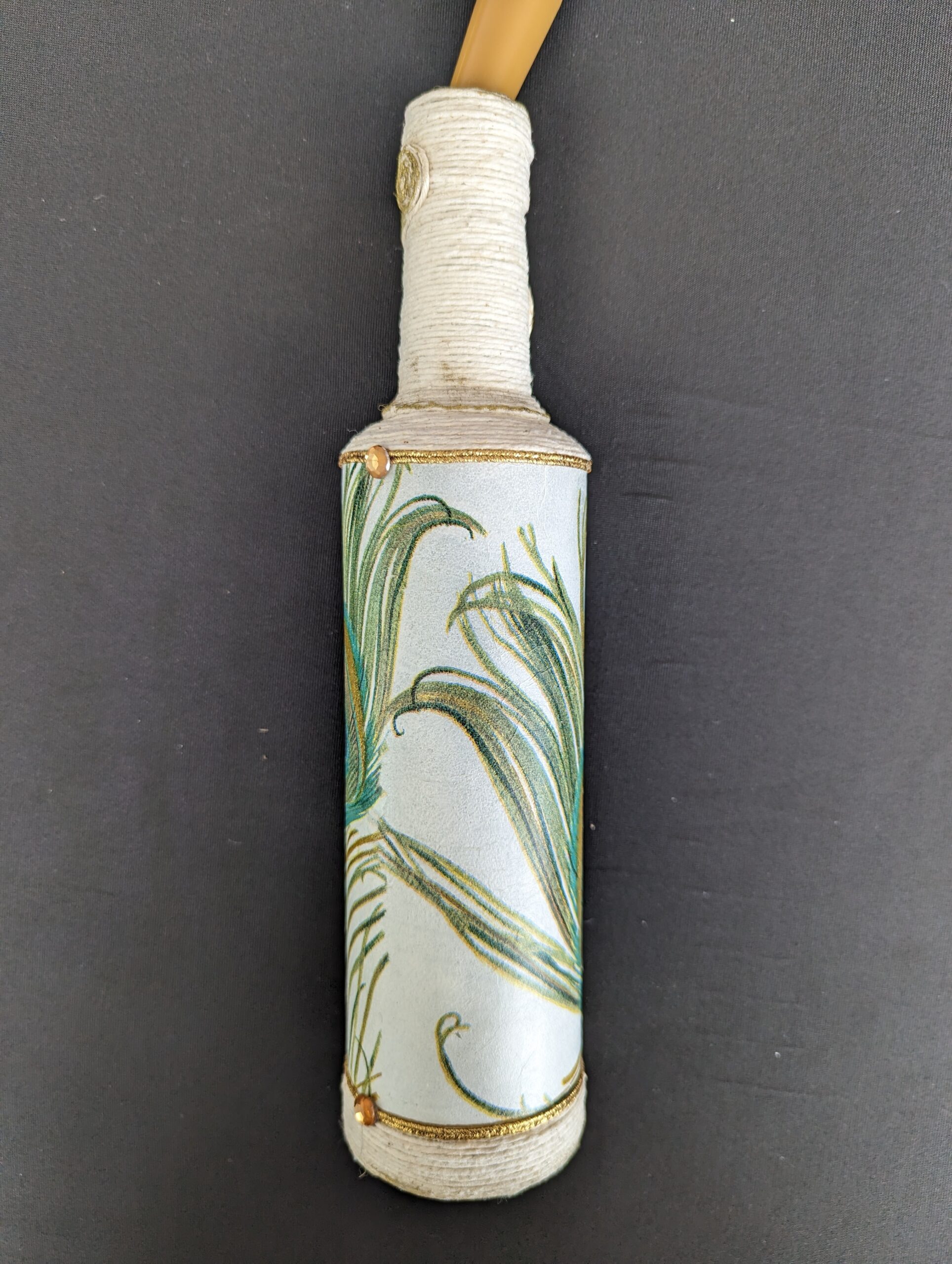 Decorated Illuminated Bottle with Peacock Feathers